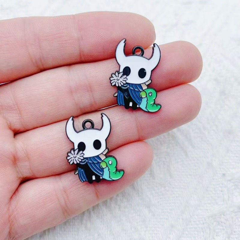 10 pendentifs en alliage motif - Party Games Event avis et prix